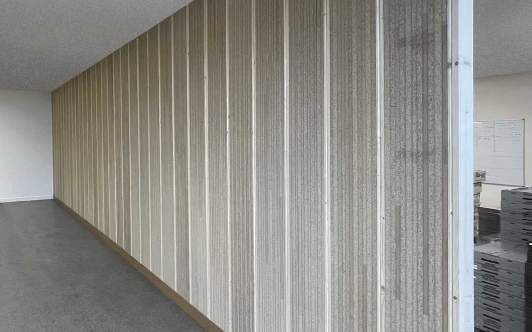 Cloison LongBoard : Transformer un déchet en composant du bâtiment.